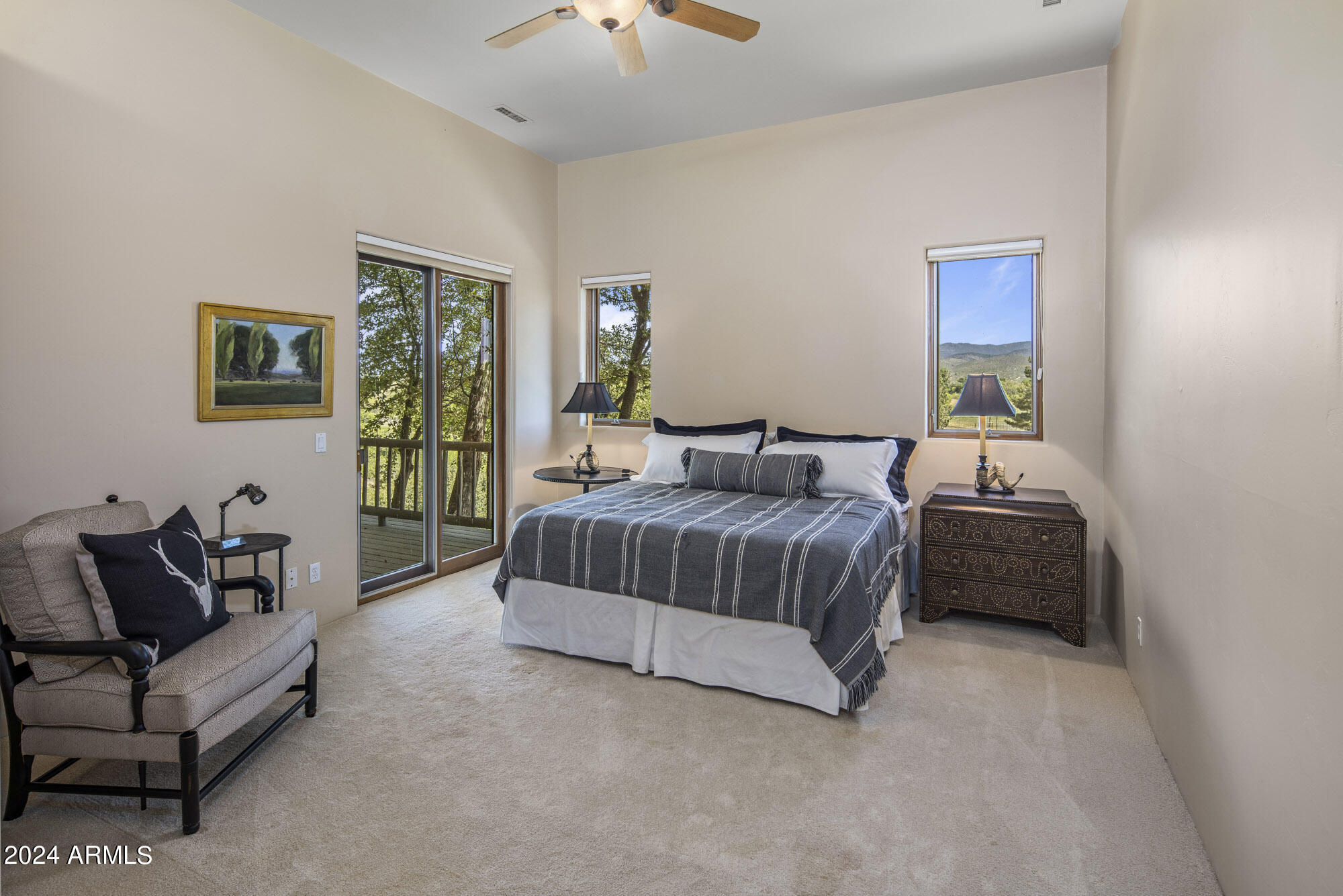 5500 Four Cross Ranch Road Skull Valley, AZ 86338 - Photo 21 of 59 a bedroom with a bed and a couch