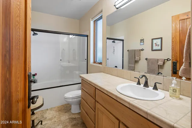 a view of a balcony with chair and table