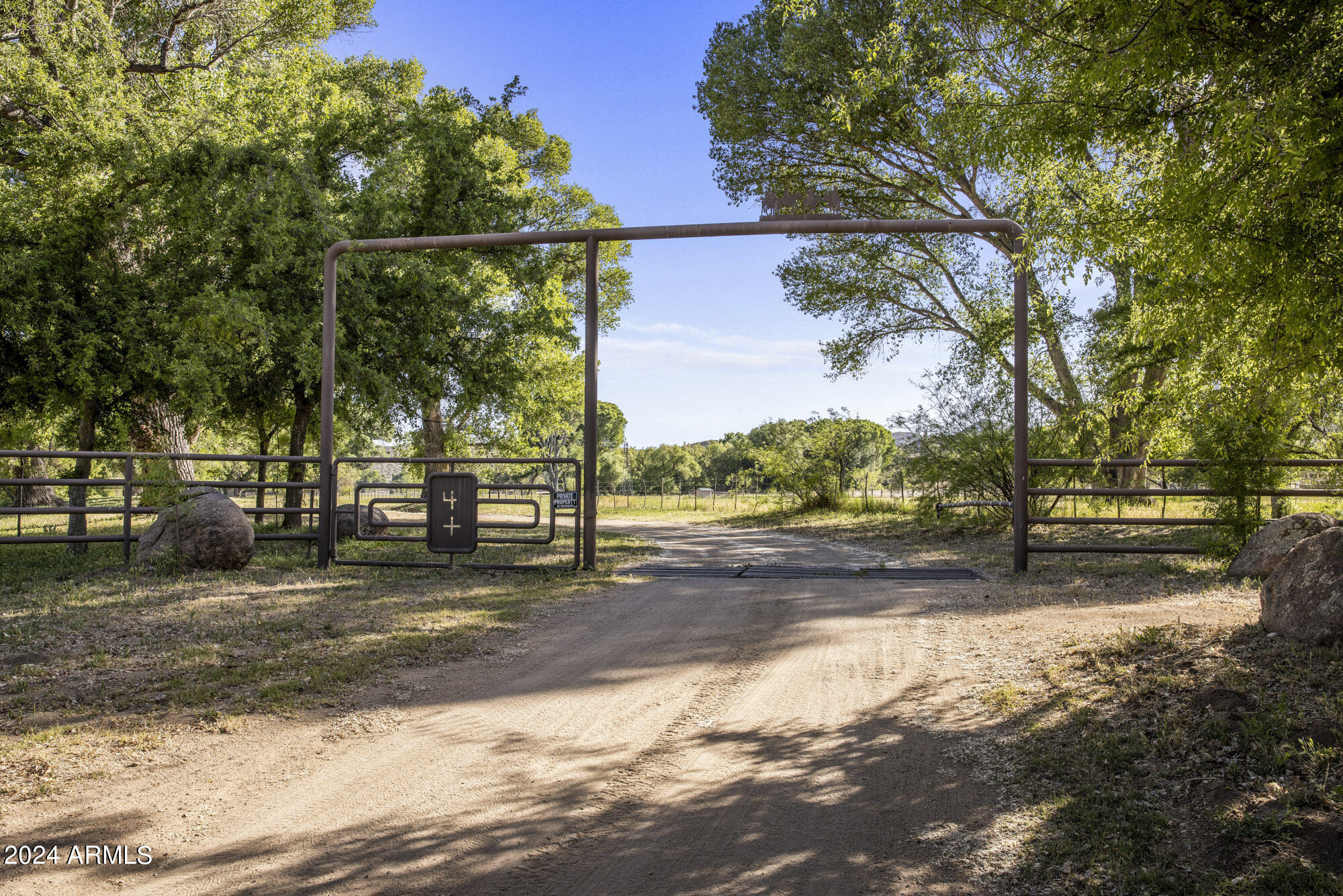 5500 Four Cross Ranch Road Skull Valley, AZ 86338 - Photo 3 of 59 a view of a yard with wooden fence