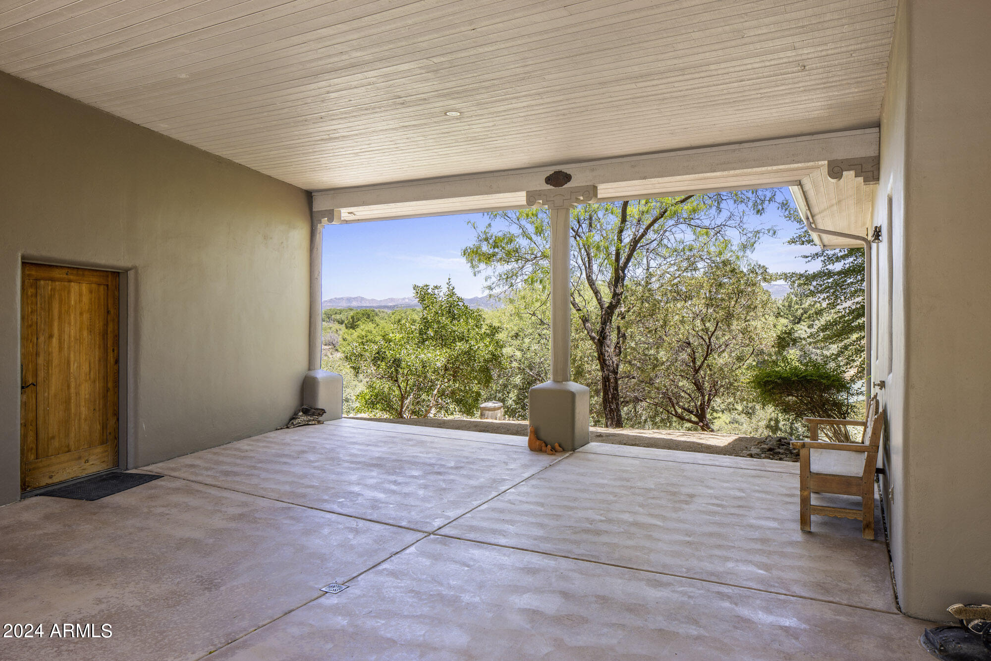 5500 Four Cross Ranch Road Skull Valley, AZ 86338 - Photo 33 of 59 a view of chair and potted plant in front of a glass door