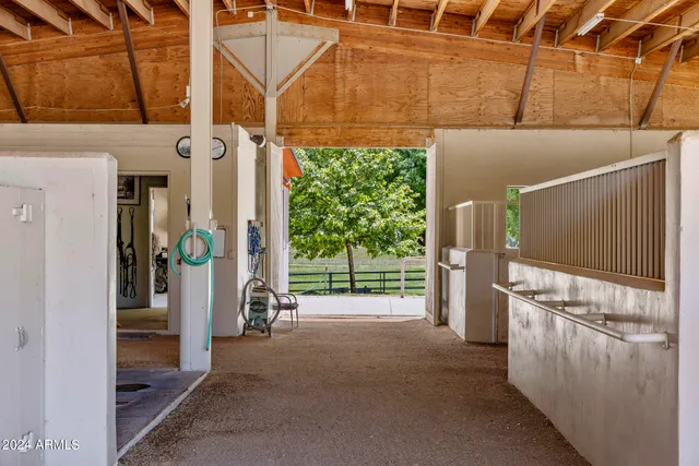 an aerial view of residential houses with outdoor space and street view