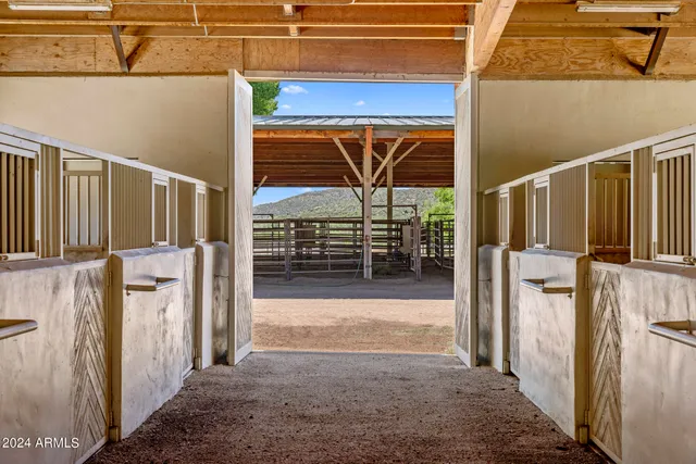 a view of house and outdoor space with swimming pool and outdoor seating