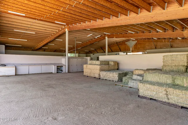 a view of a wooden deck with a backyard