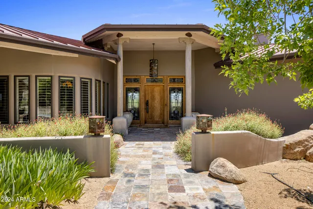 a view of an entryway with wooden floor and a door