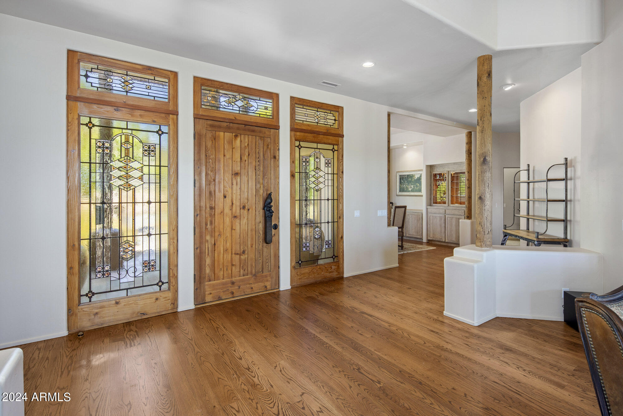 5500 Four Cross Ranch Road Skull Valley, AZ 86338 - Photo 8 of 59 a view of an entryway with wooden floor and a door