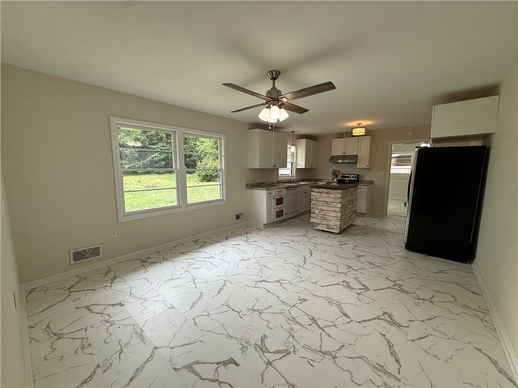 2304 Poplar Lane Anderson, SC 29621 - Photo 16 of 33 This bright kitchen features a functional layout and abundant natural light.