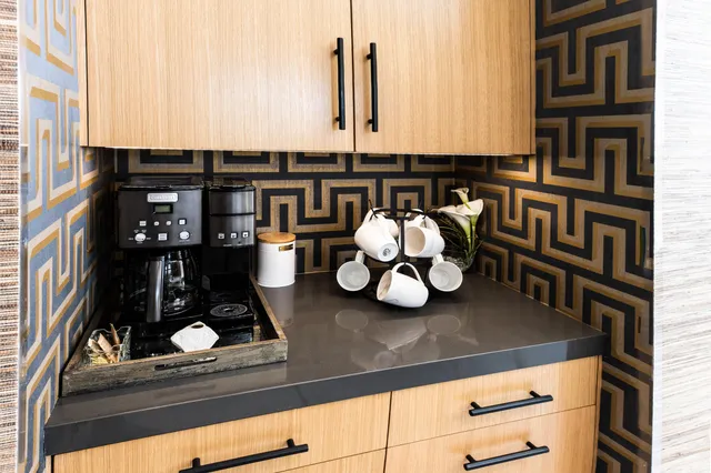 a stove top oven sitting inside of a kitchen