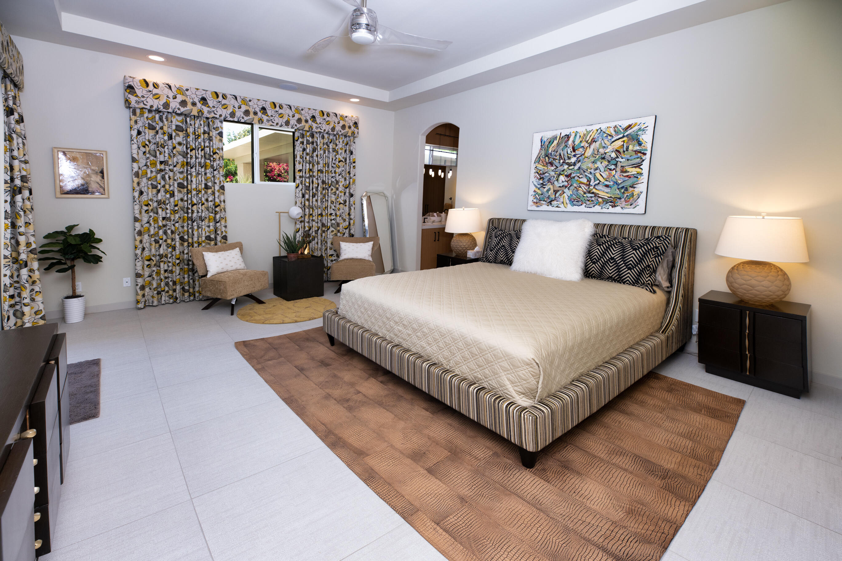 12 Varsity Circle Rancho Mirage, CA 92270 - Photo 22 of 59 a bedroom with a large bed and a couch