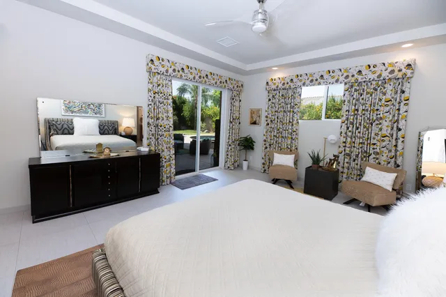 a spacious bathroom with a double vanity sink mirror and double