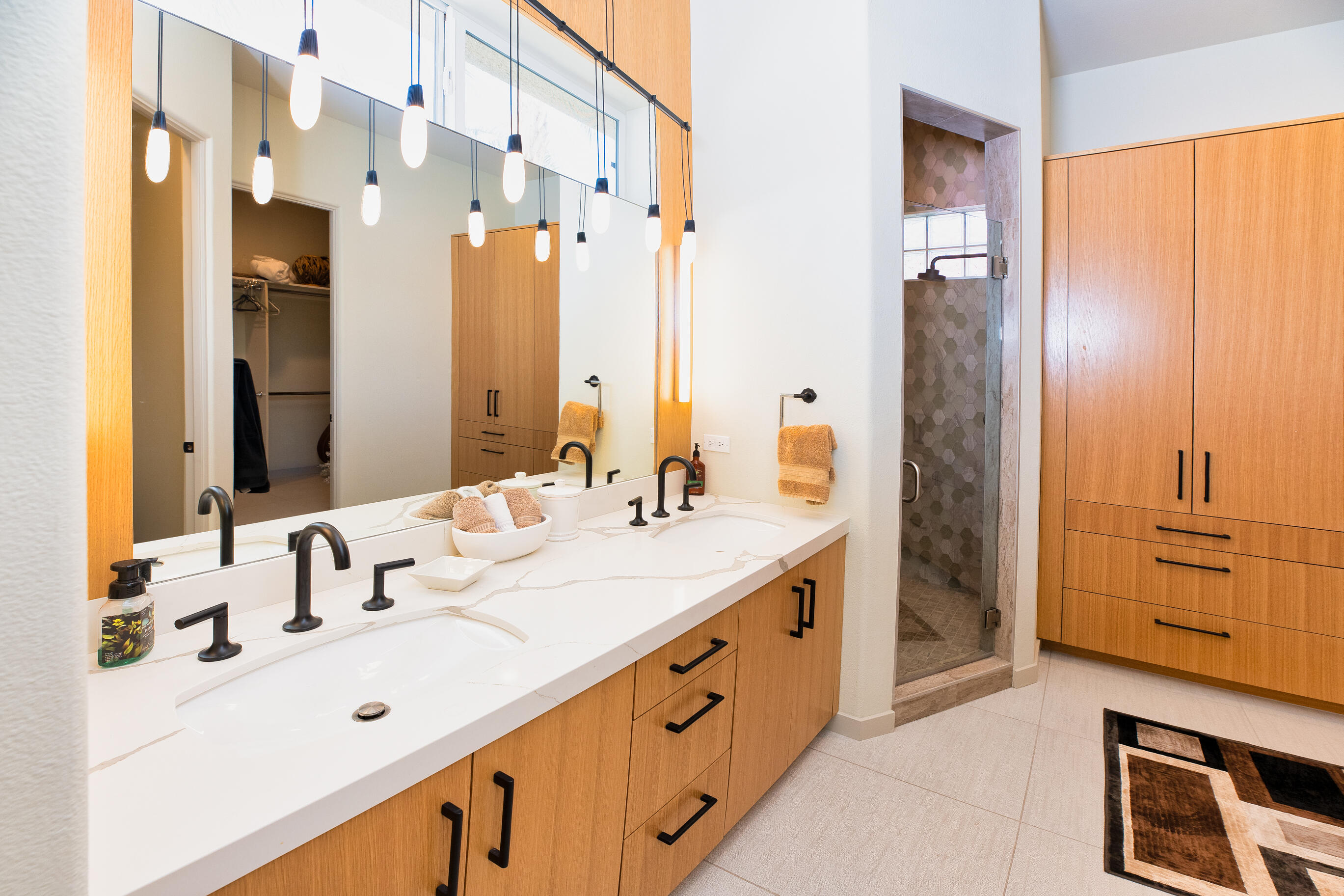 12 Varsity Circle Rancho Mirage, CA 92270 - Photo 24 of 59 a spacious bathroom with a double vanity sink mirror and double