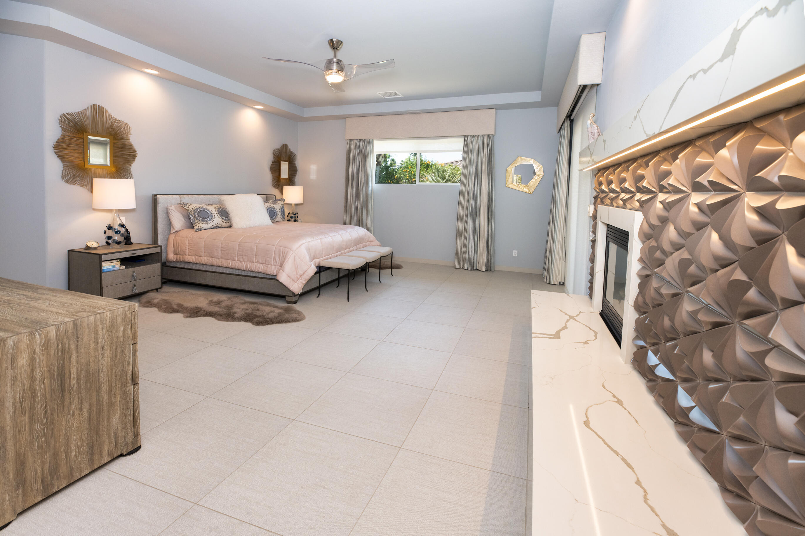 12 Varsity Circle Rancho Mirage, CA 92270 - Photo 28 of 59 a spacious bedroom with a bed and window