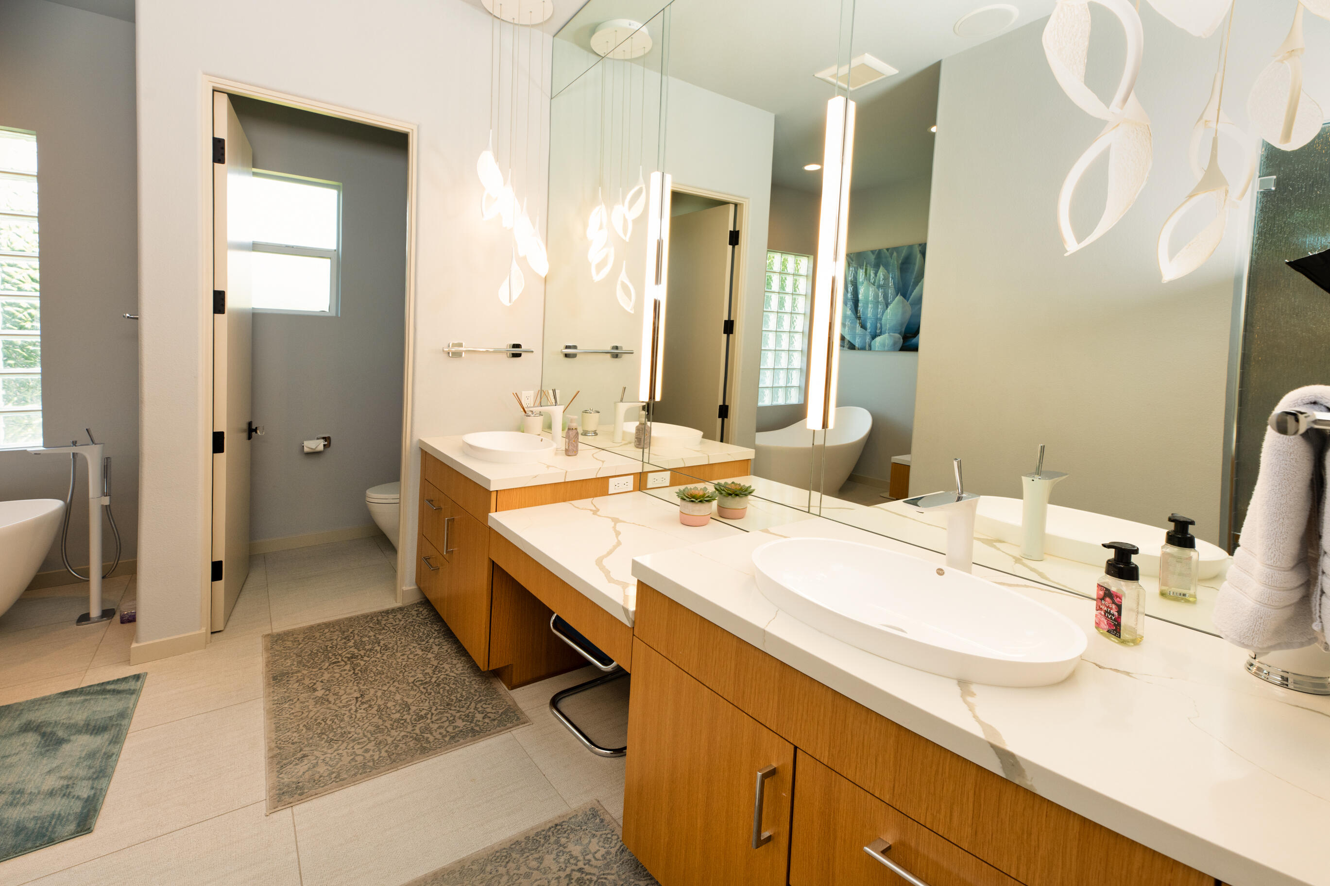 12 Varsity Circle Rancho Mirage, CA 92270 - Photo 31 of 59 a bathroom with a sink double vanity and a mirror