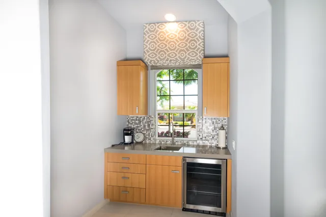 a bathroom with a toilet and a mirror