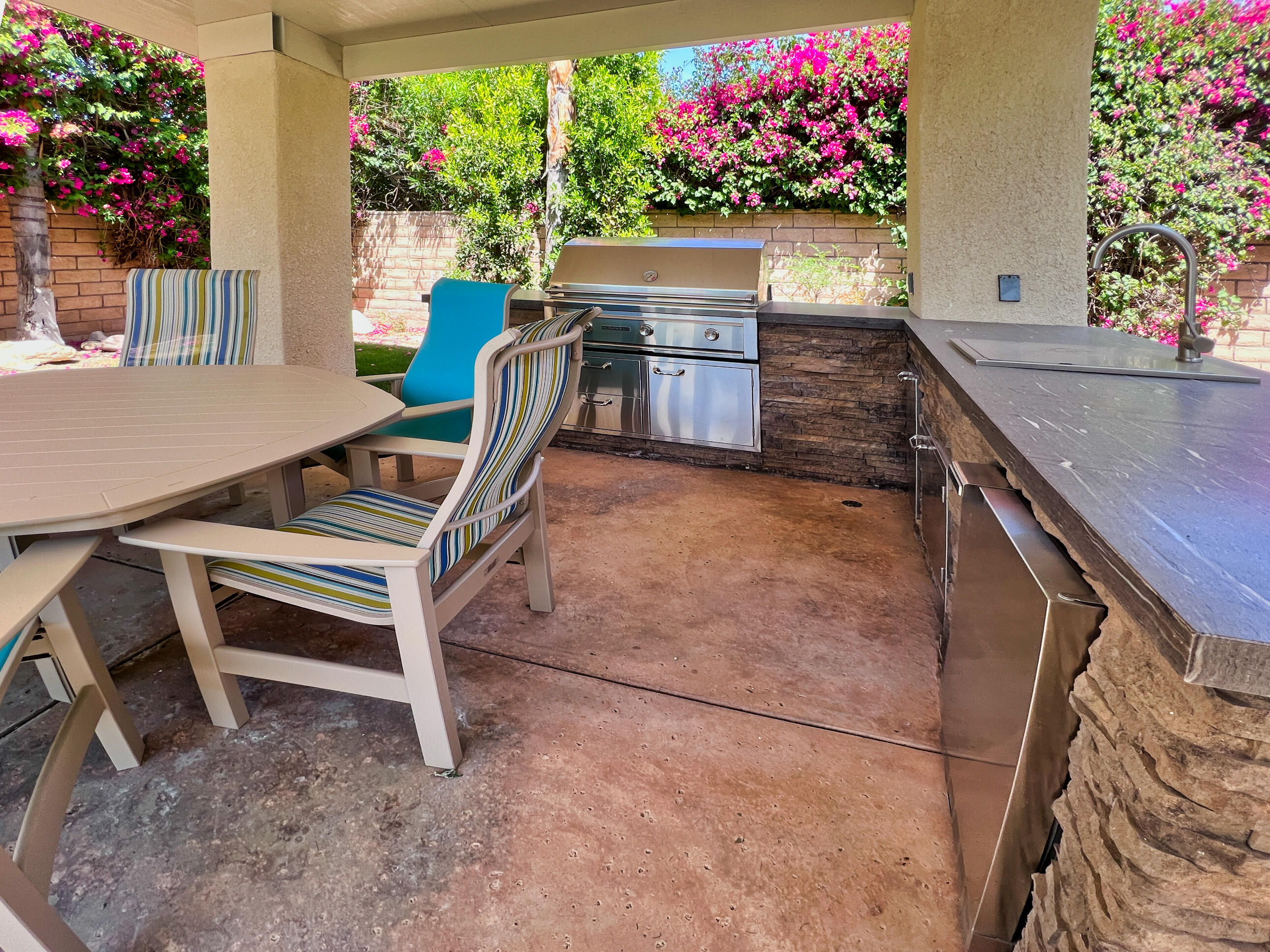 12 Varsity Circle Rancho Mirage, CA 92270 - Photo 41 of 59 a view of balcony with two chairs and a potted plant