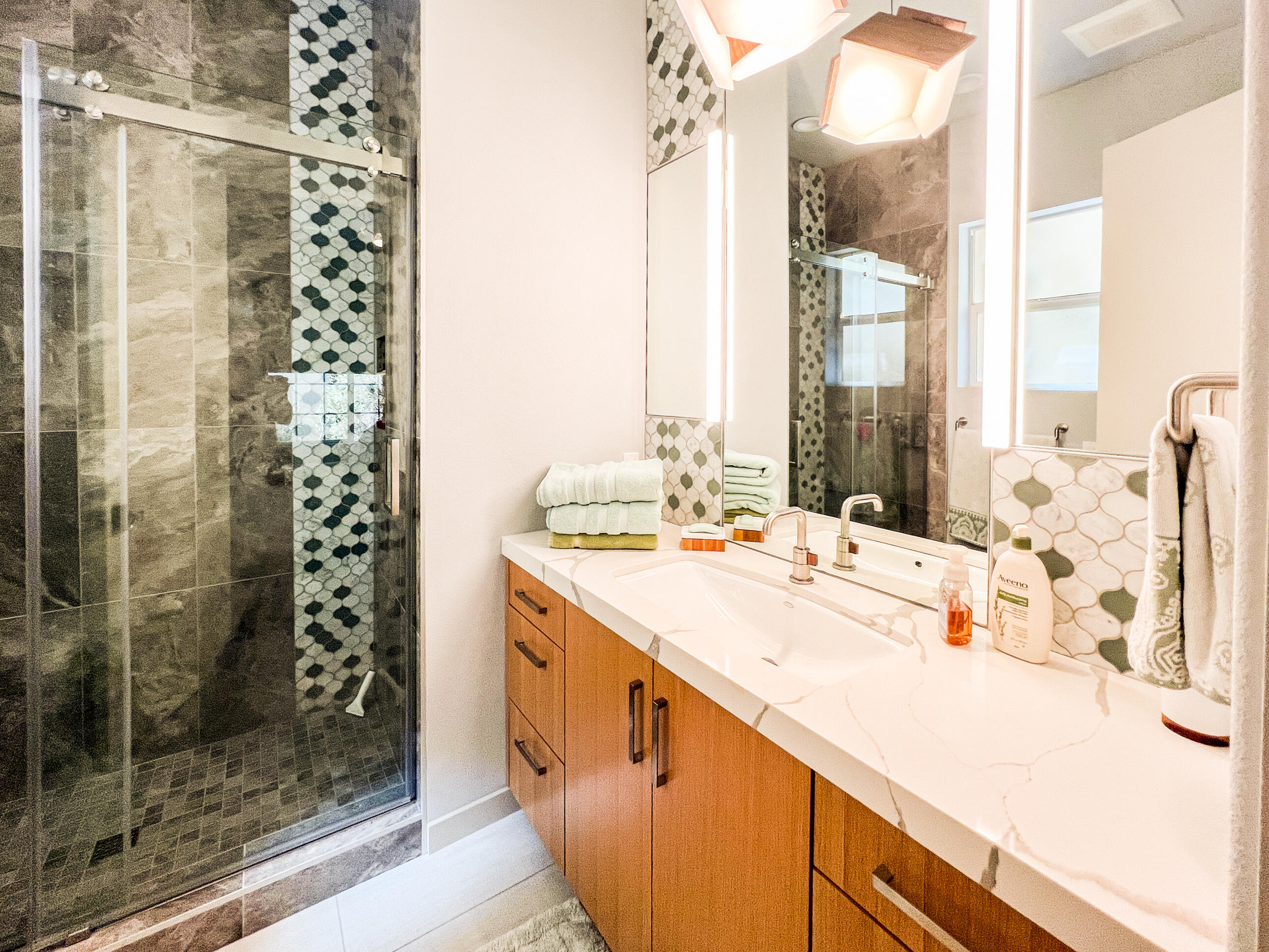 12 Varsity Circle Rancho Mirage, CA 92270 - Photo 50 of 59 a bathroom with a double vanity sink mirror and shower