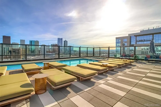 a view of swimming pool with outdoor seating