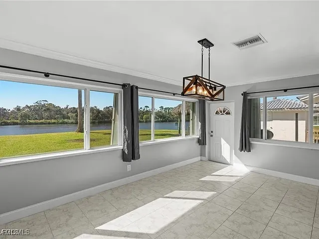 a view of a living room and floor to ceiling window