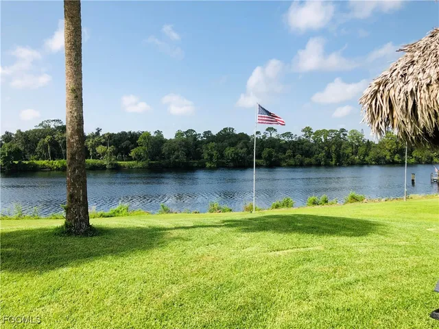 a view of a lake with a yard