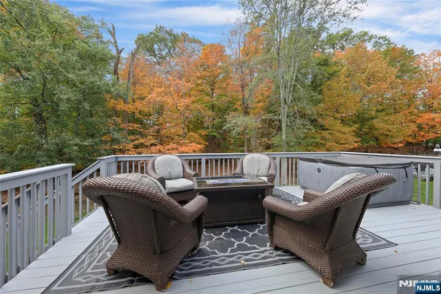 a balcony with wooden floor and fence