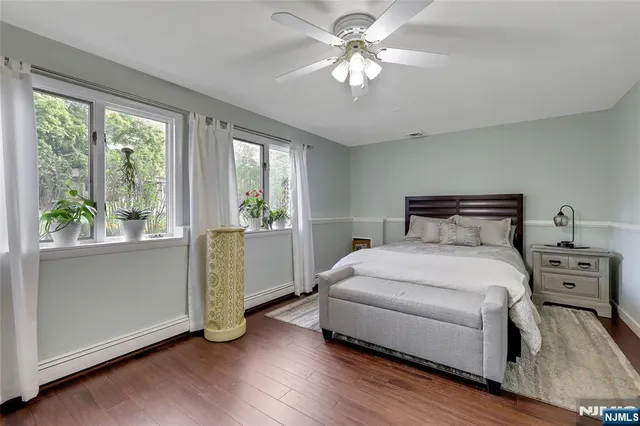 a bedroom with a large bed and a large window