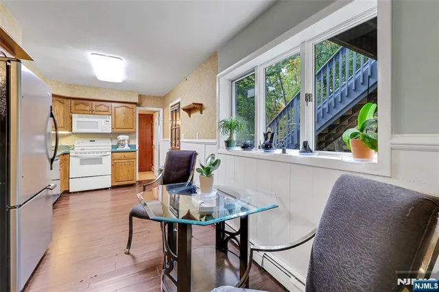 a view of a dining room with furniture window and outside view