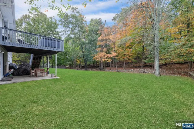 a view of a chair and table in the garden