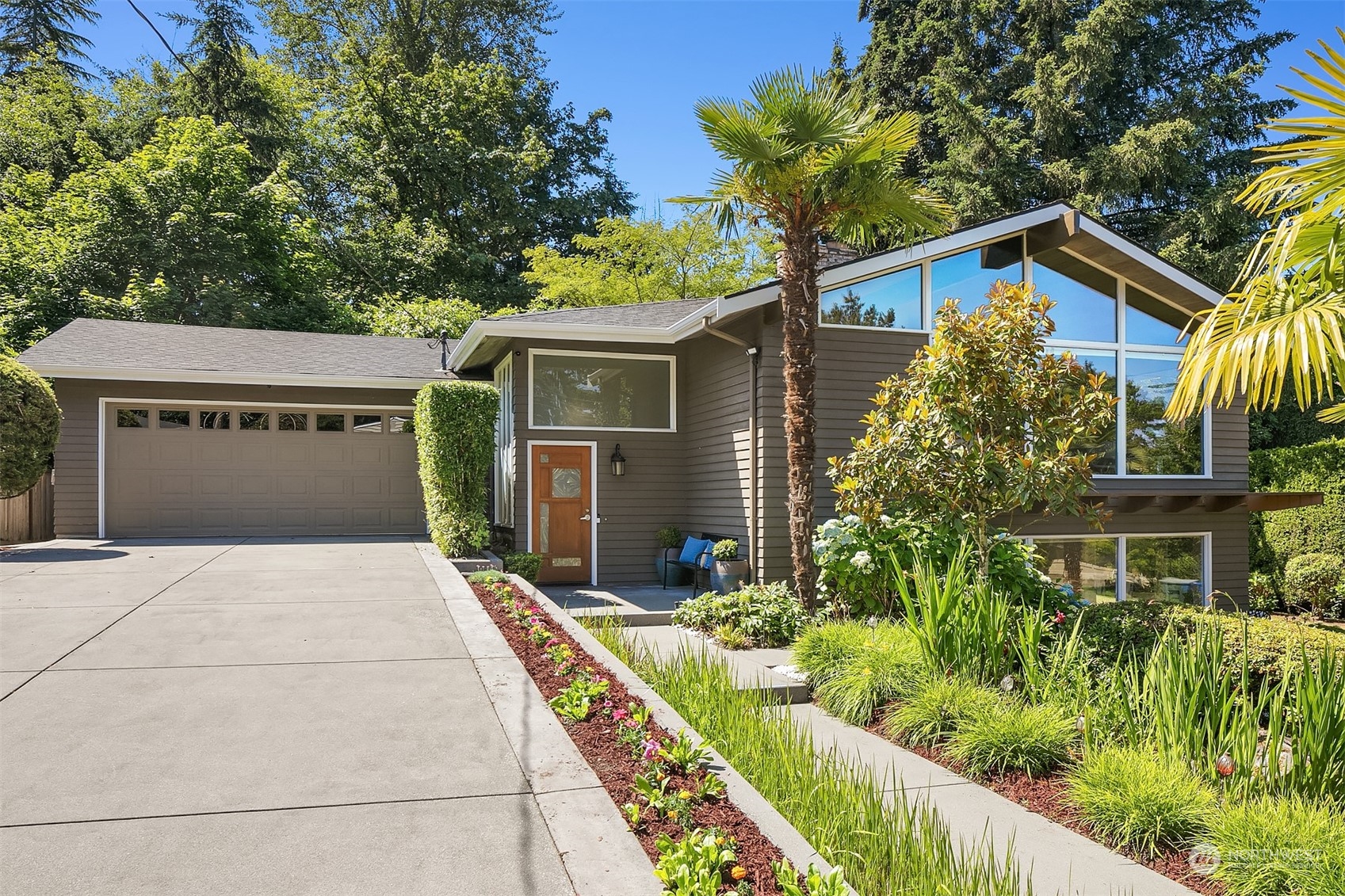 12819 Southeast 45th Place Bellevue, WA 98006 - Photo 1 of 1 front view of a house with a yard
