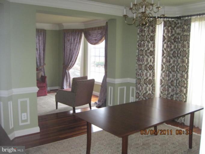 10811 Catron Road Perry Hall, MD 21128 - Photo 12 of 30 a view of a dining room with furniture window and wooden floor