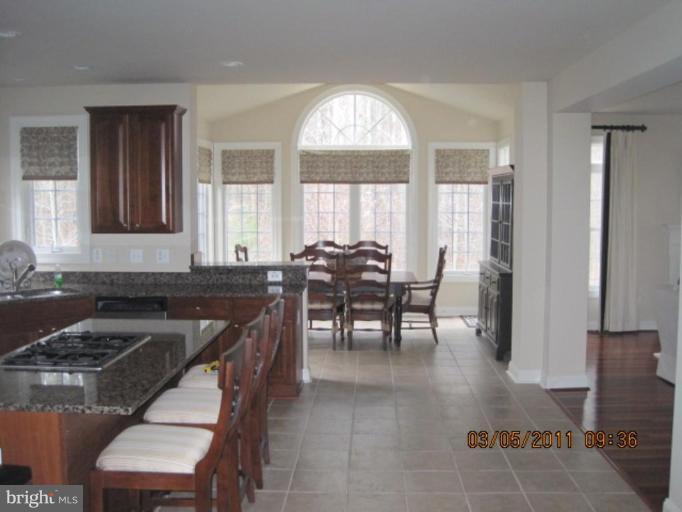 10811 Catron Road Perry Hall, MD 21128 - Photo 13 of 30 a view of a a dining room with furniture window and outside view