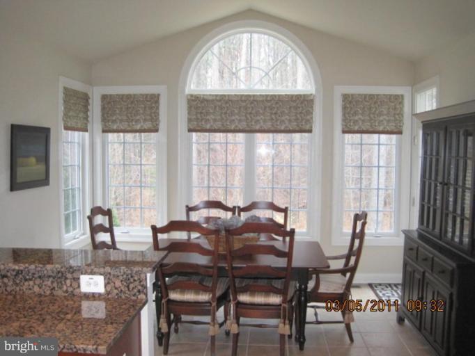 10811 Catron Road Perry Hall, MD 21128 - Photo 14 of 30 a view of a dining room with furniture and windows