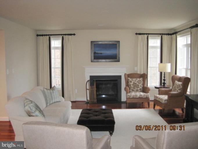 10811 Catron Road Perry Hall, MD 21128 - Photo 18 of 30 a living room with furniture and a fireplace