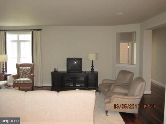 10811 Catron Road Perry Hall, MD 21128 - Photo 19 of 30 a living room with furniture and a flat screen tv