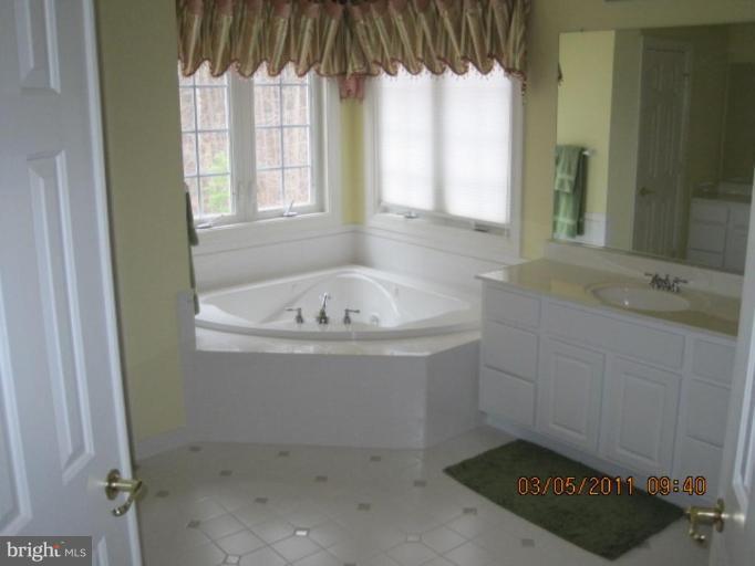 10811 Catron Road Perry Hall, MD 21128 - Photo 23 of 30 a bathroom with a bathtub and shower