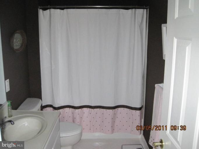 10811 Catron Road Perry Hall, MD 21128 - Photo 26 of 30 a bathroom with a sink and a mirror
