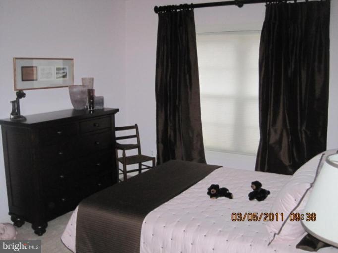 10811 Catron Road Perry Hall, MD 21128 - Photo 29 of 30 a bedroom with a bed and a window
