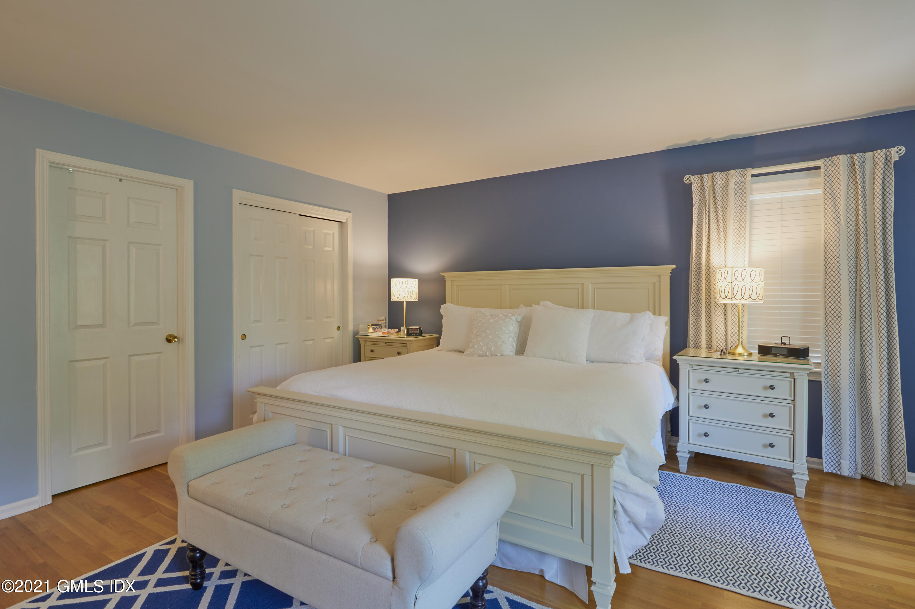 42 Ritch Avenue Greenwich, CT 06830 - Photo 18 of 32 a bedroom with a bed and a dresser
