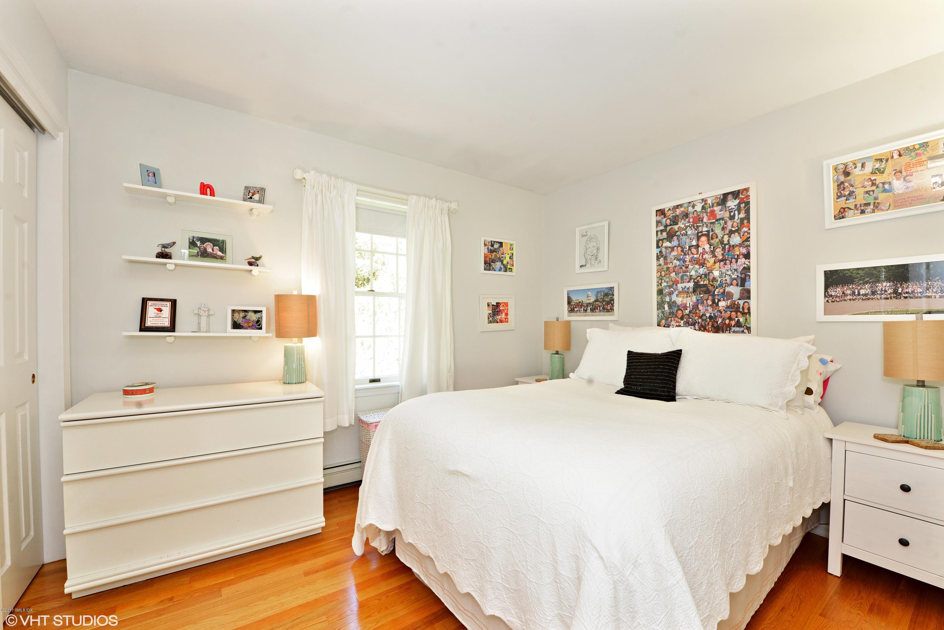 42 Ritch Avenue Greenwich, CT 06830 - Photo 21 of 32 a bedroom with a bed and a cabinets