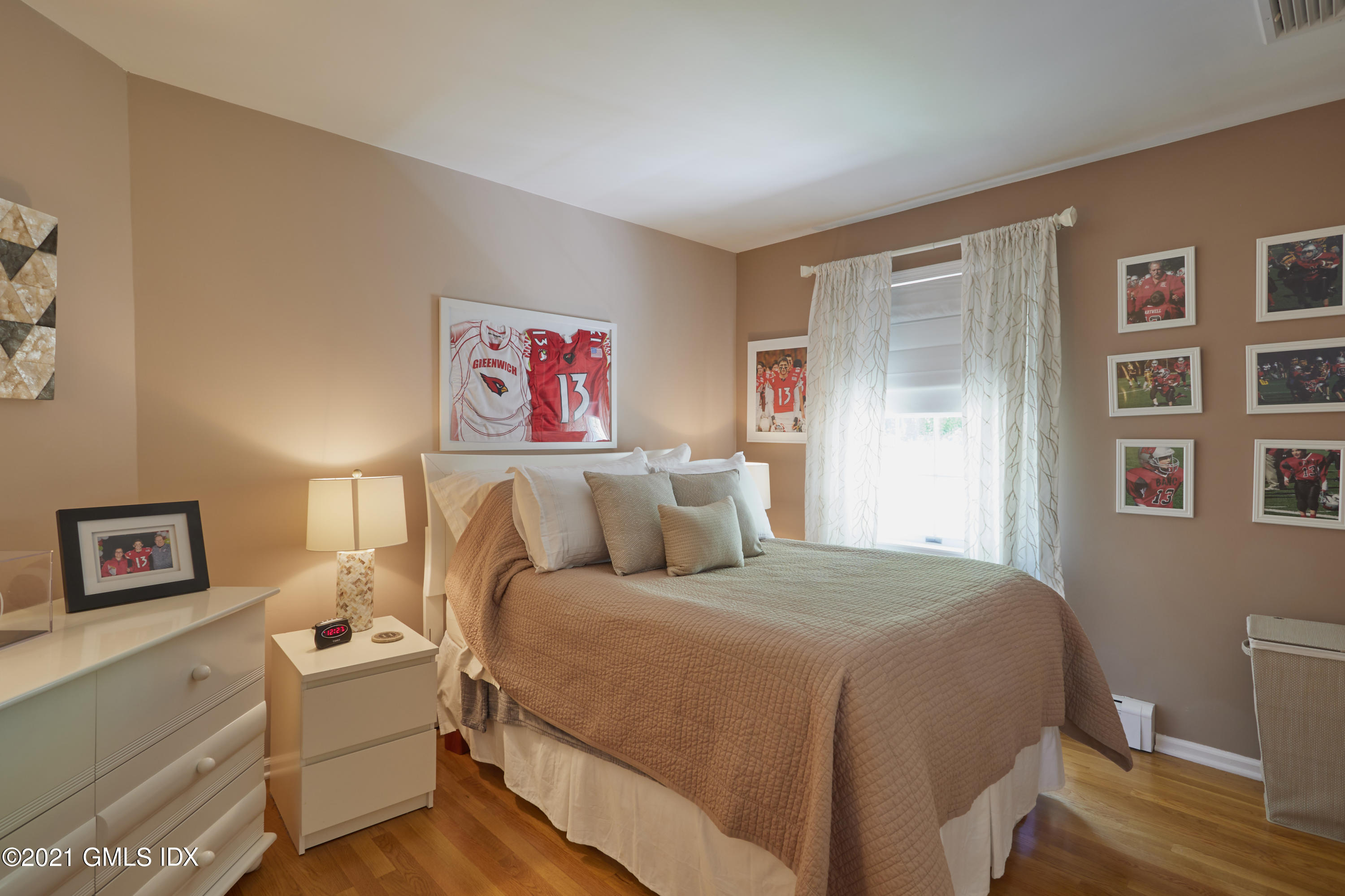 42 Ritch Avenue Greenwich, CT 06830 - Photo 24 of 32 a bed room with a bed and a couch