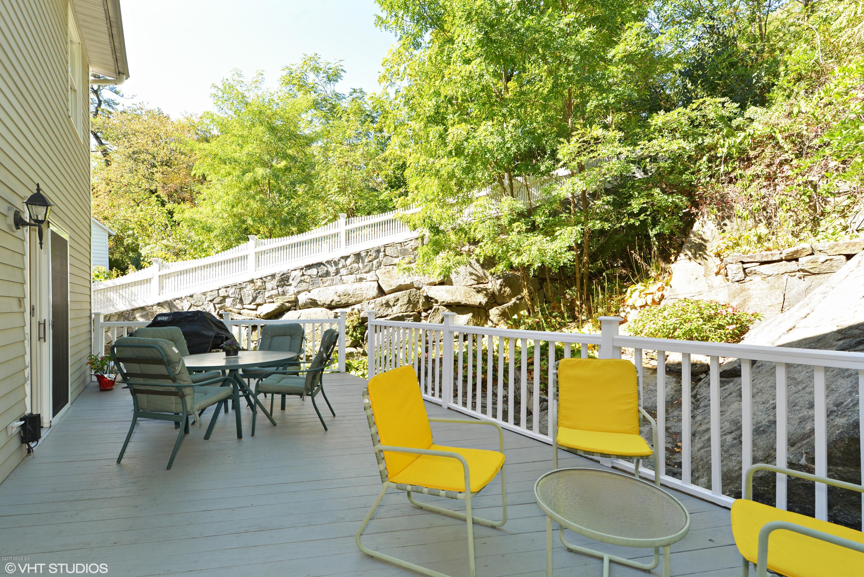 42 Ritch Avenue Greenwich, CT 06830 - Photo 28 of 32 a balcony with table and chairs