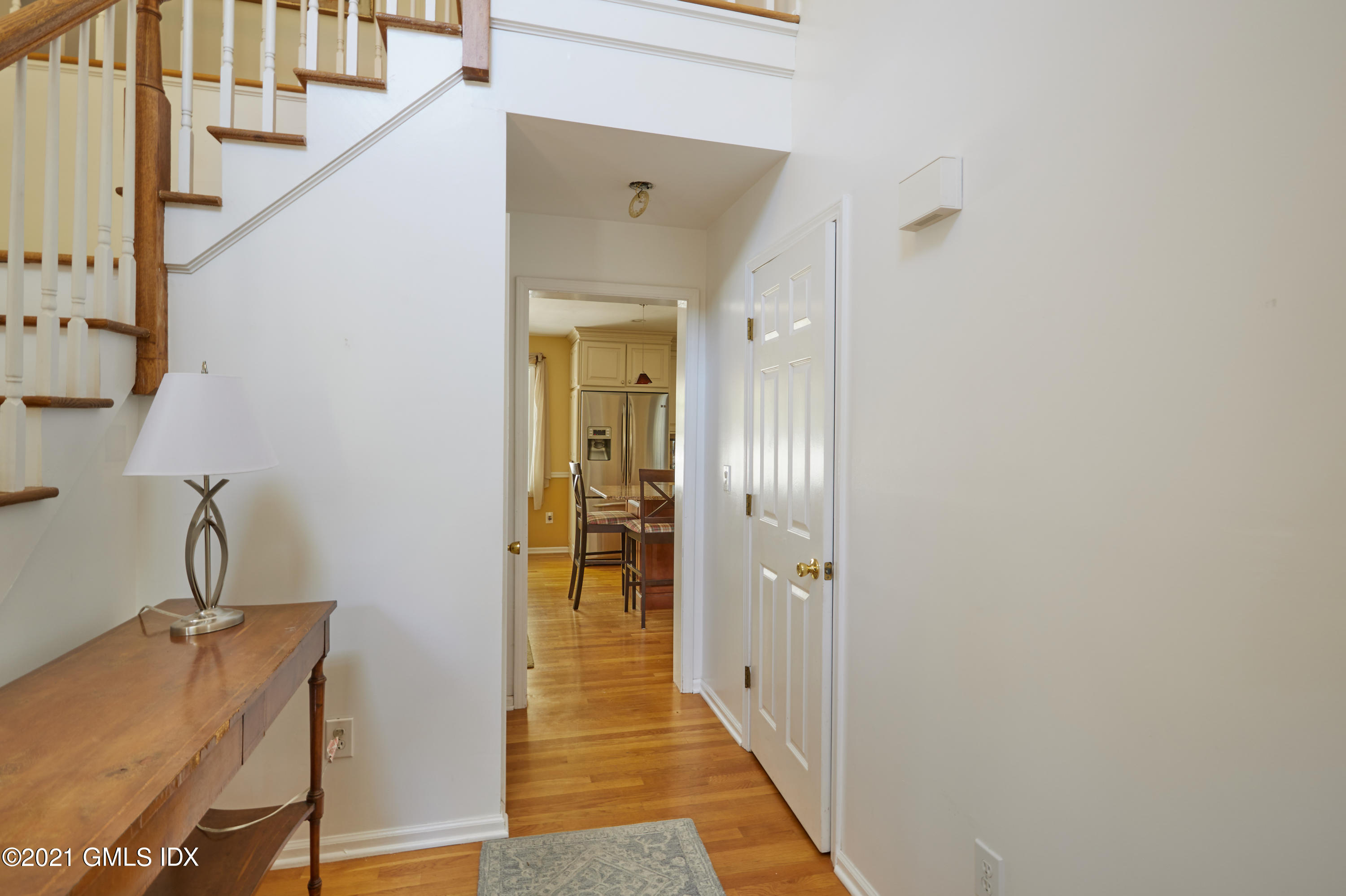 42 Ritch Avenue Greenwich, CT 06830 - Photo 4 of 32 a view of a hallway with wooden floor and staircase