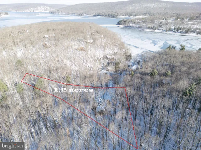 a view of a chairs and table on the deck