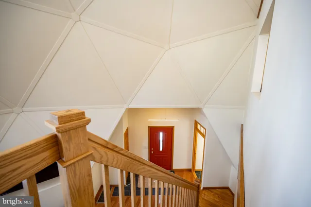 a view of balcony with wooden floor and fence