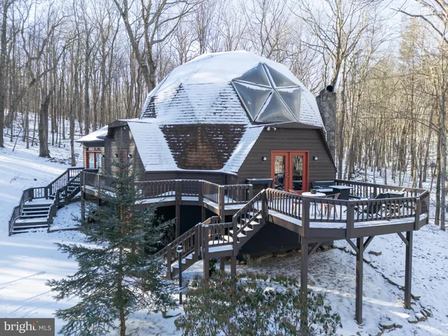 a view of a house with a iron gate