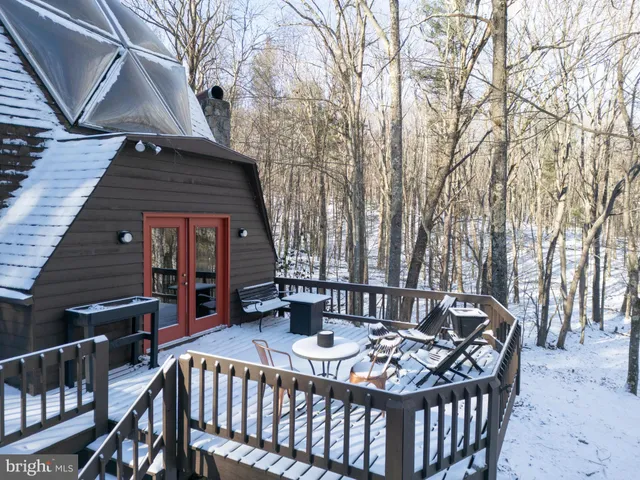 a view of a balcony with chairs
