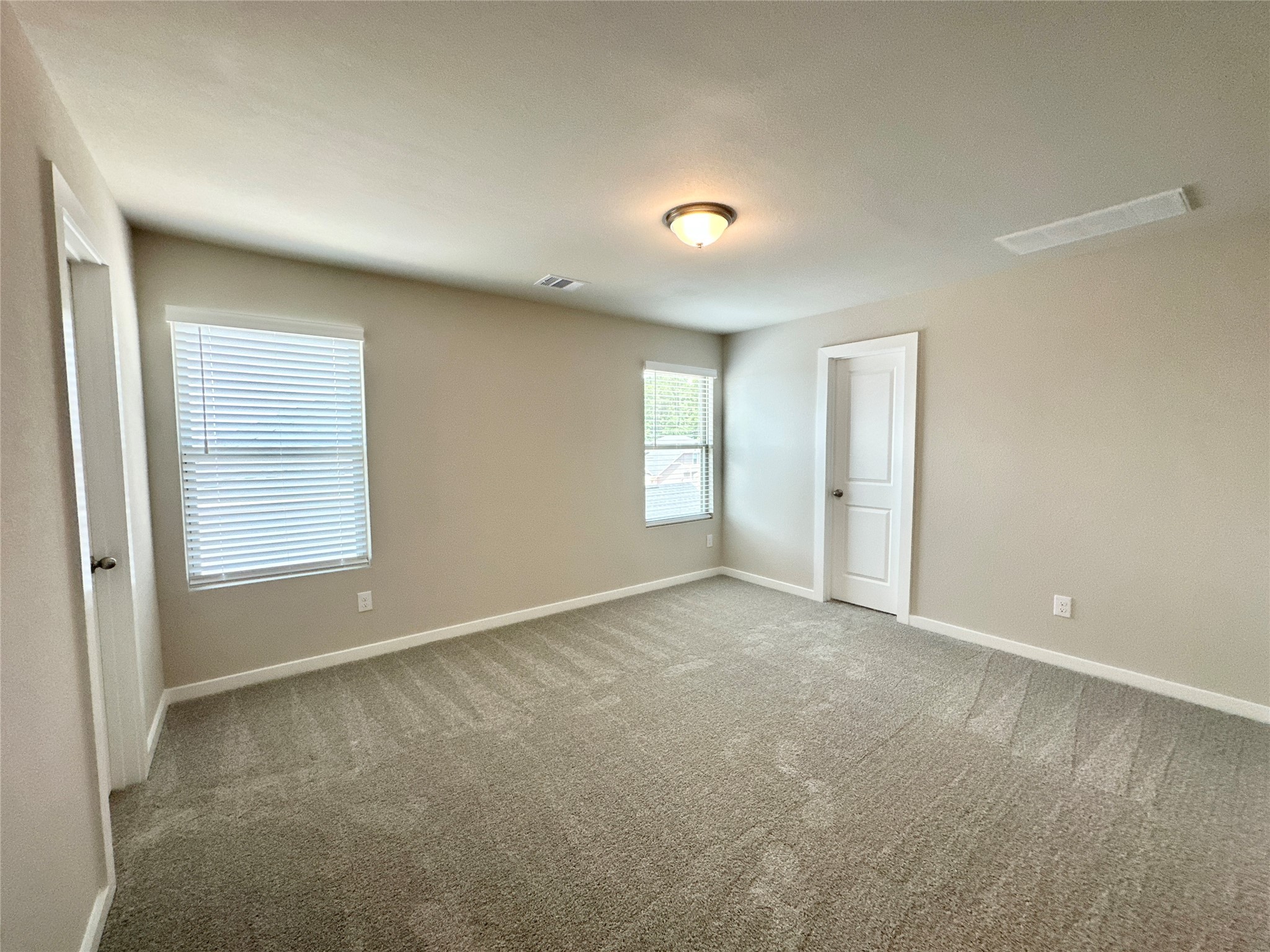 12176 Ridge Top Drive Conroe, TX 77304 - Photo 13 of 27 a view of an empty room with a window