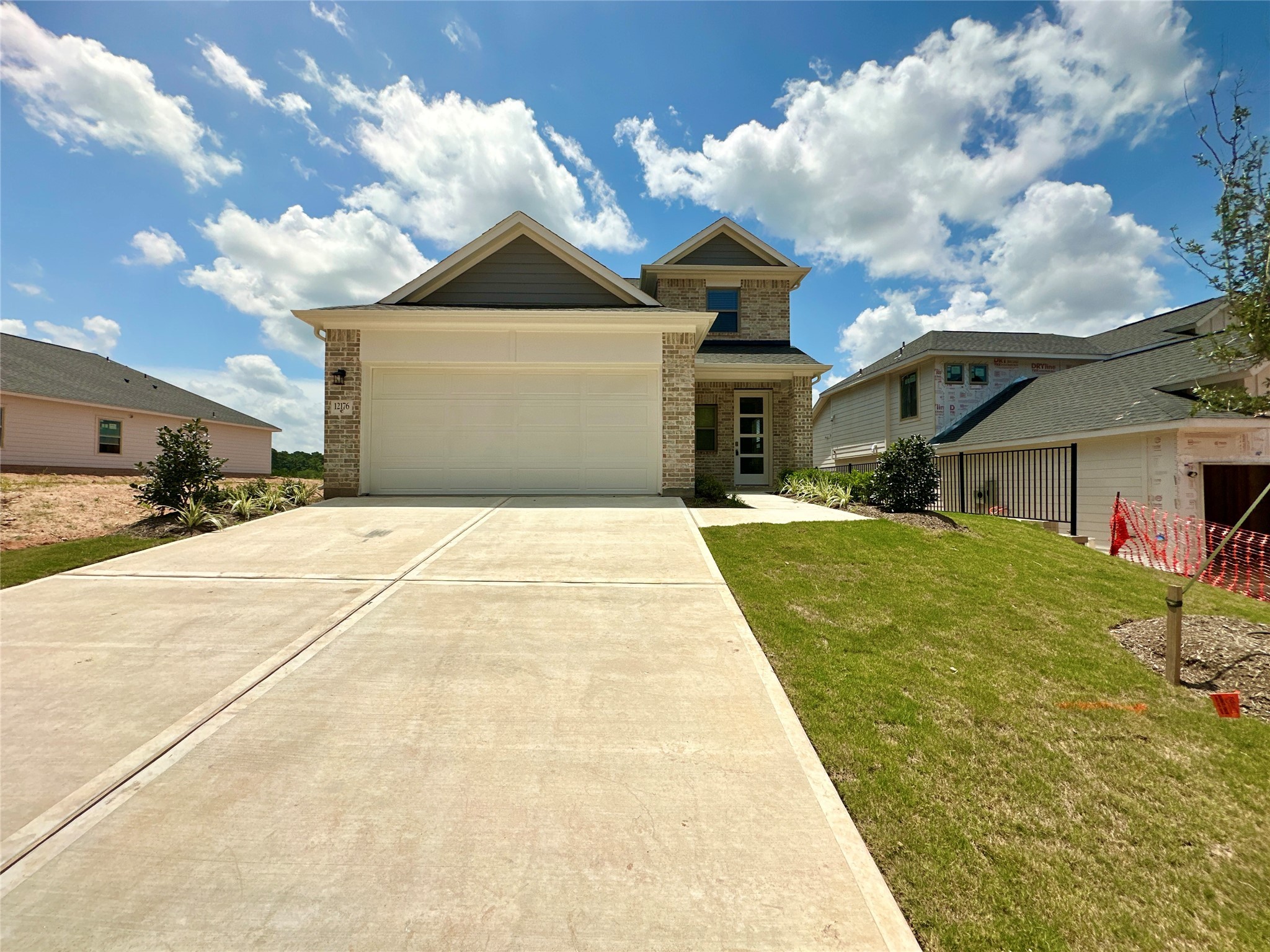 12176 Ridge Top Drive Conroe, TX 77304 - Photo 2 of 27 a front view of a house with a yard