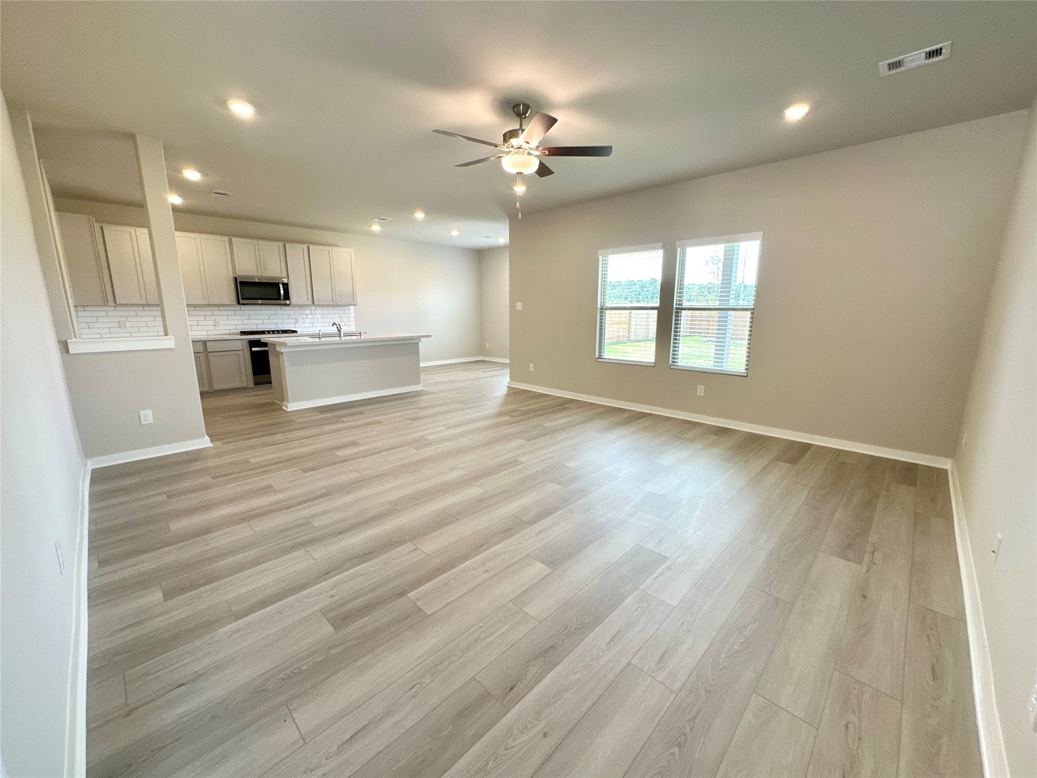 12176 Ridge Top Drive Conroe, TX 77304 - Photo 5 of 27 a view of kitchen with cabinets and wooden floor