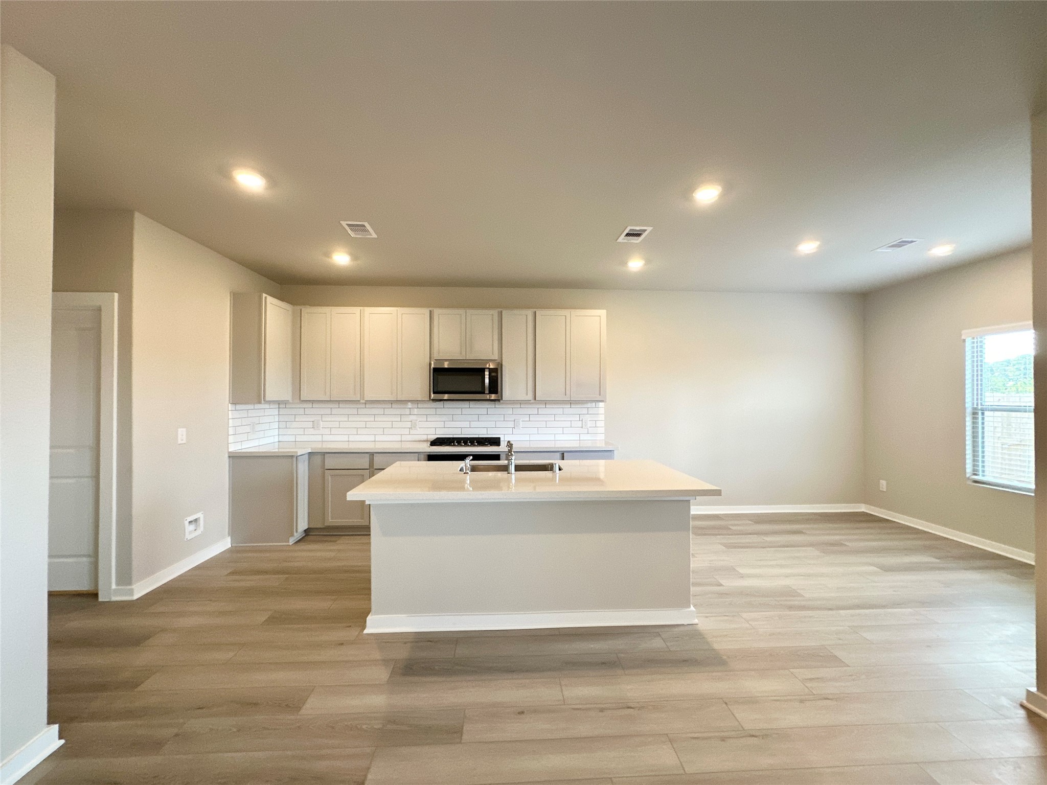 12176 Ridge Top Drive Conroe, TX 77304 - Photo 8 of 27 a view of kitchen with stainless steel appliances granite countertop refrigerator stove top oven and cabinets