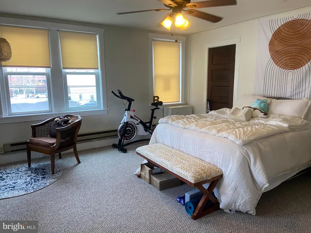 a bedroom with bed and a window