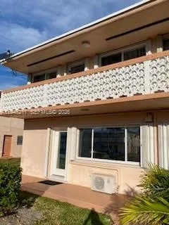 a view of a house with a large window